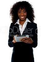 Young businesswoman using wireless tablet pc