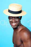 Studio portrait of young man with hat and eyewear