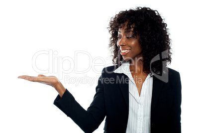 African woman with open palm. Copy space