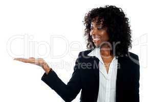 African woman with open palm. Copy space