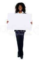 Corporate woman displaying white ad board