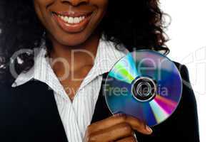 Cropped image of smiling woman showing DVD