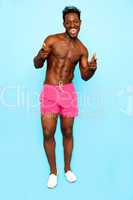 Funny african guy posing casually in shorts