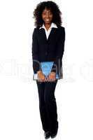 African businesswoman carrying documents