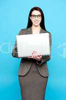 Young active businesswoman working on laptop