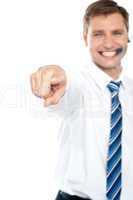Cheerful male executive pointing at you