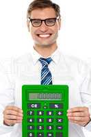Corporate man showing big green calculator