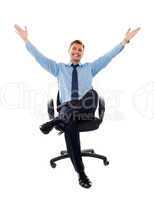 Successful businessman seated on chair