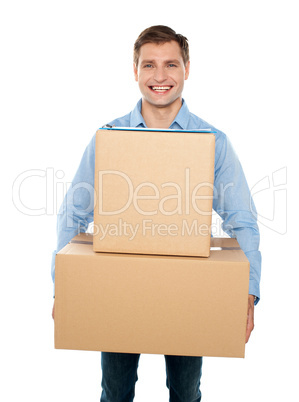 Young man holding cardboard boxes