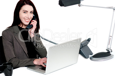 Female operator talking on phone and smiling