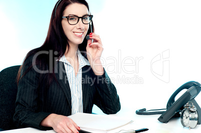 Female customer care executive holding mic