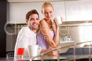 couple in kitchen having breakfast
