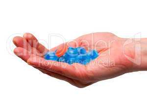blue candies in a hand