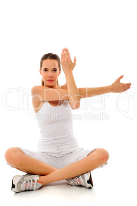 Young woman doing gymnastics on white background studio