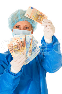 female surgeon holding banknotes