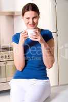 woman drinking a cup of tea