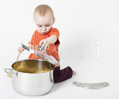 baby with big cooking pot