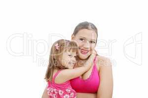 Portrait of Hispanic pregnant woman with daughter isolated over