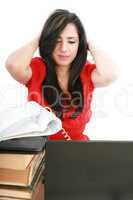 Young tired business woman with headache sitting at computer in