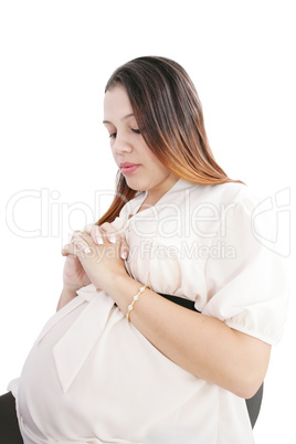 Young woman pregnant praying isolated on a white background