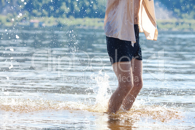 legs of the man jumping in the water