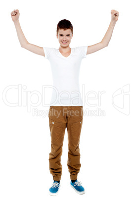 Cheerful young boy celebrating success