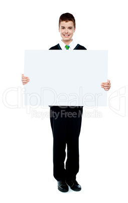 Young boy showing blank billboard