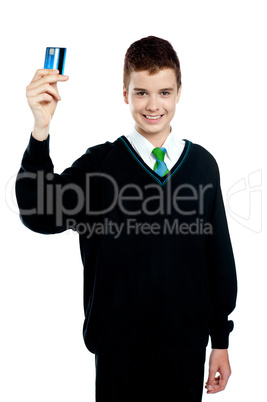 School boy holding credit card