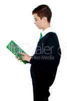 School boy using big green calculator