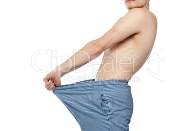 Cropped image of man wearing loose shorts