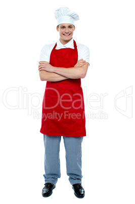 Handsome young cook posing in uniform