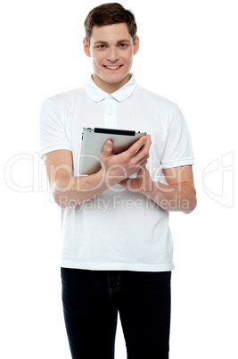 Casual teen operating touch screen device