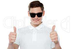 Handsome guy gesturing double thumbs up