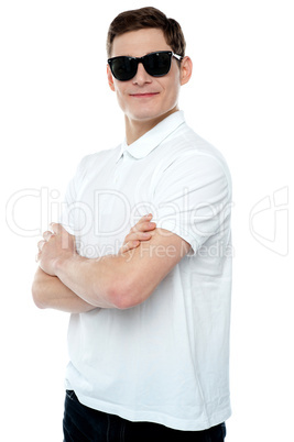 Casual young man posing with crossed arms