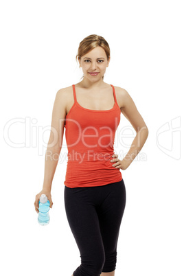 hübsche fitness frau mit einer flasche wasser