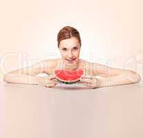 Attractive woman with watermelon piece