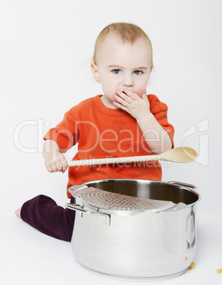baby with big cooking pot and wooden spoon
