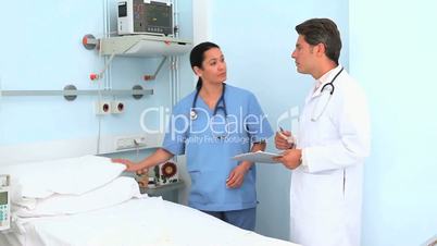 Nurse making a medical bed