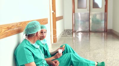 Surgeons talking next to a doctor