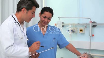 Doctor and nurse talking with a patient