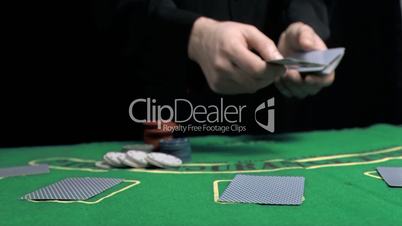 Man dealing the cards in slow motion