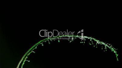 Green paint in super slow motion being splashed