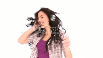 Woman dancing while listening to music