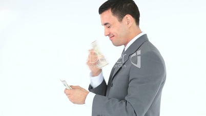 Side view of a businessman counting his dollars banknotes