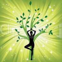 Woman in the yoga tree asana