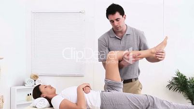 Woman receiving a massage from a physiotherapist