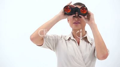 Elegant woman holding binoculars