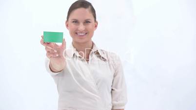 Classy woman showing a green card