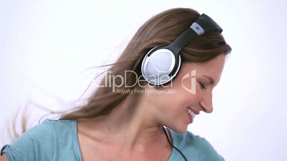Woman wearing headphone while dancing