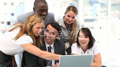 Business team looking at a laptop